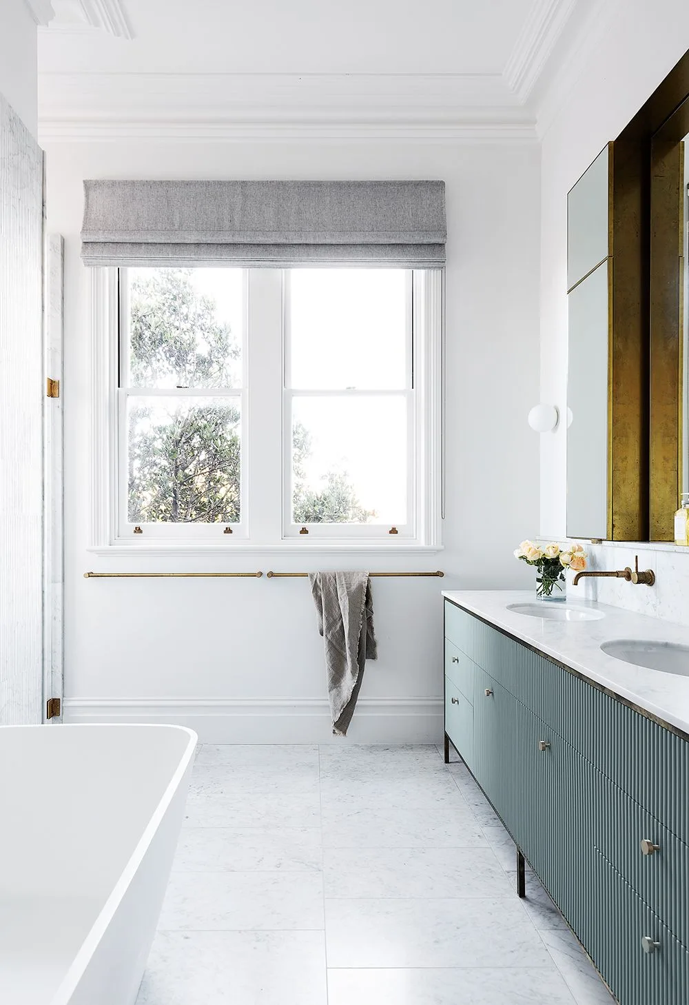 Large marble and brass bathroom