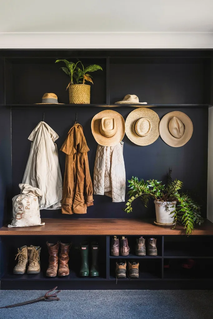 Modern farmhouse mudroom in black and timber