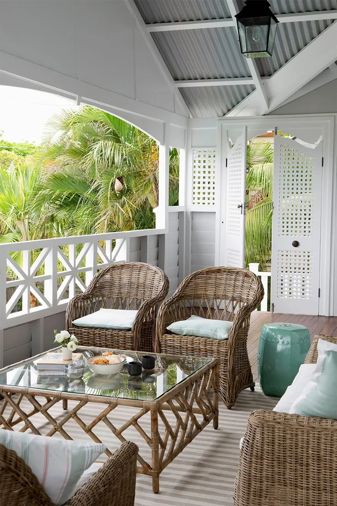 Queenslander verandah with Hamptons style cane furniture outdoor living area