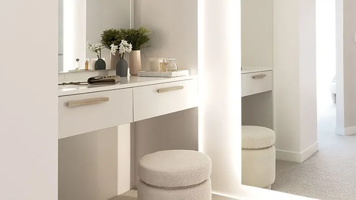White walk in wardrobe with dressing table