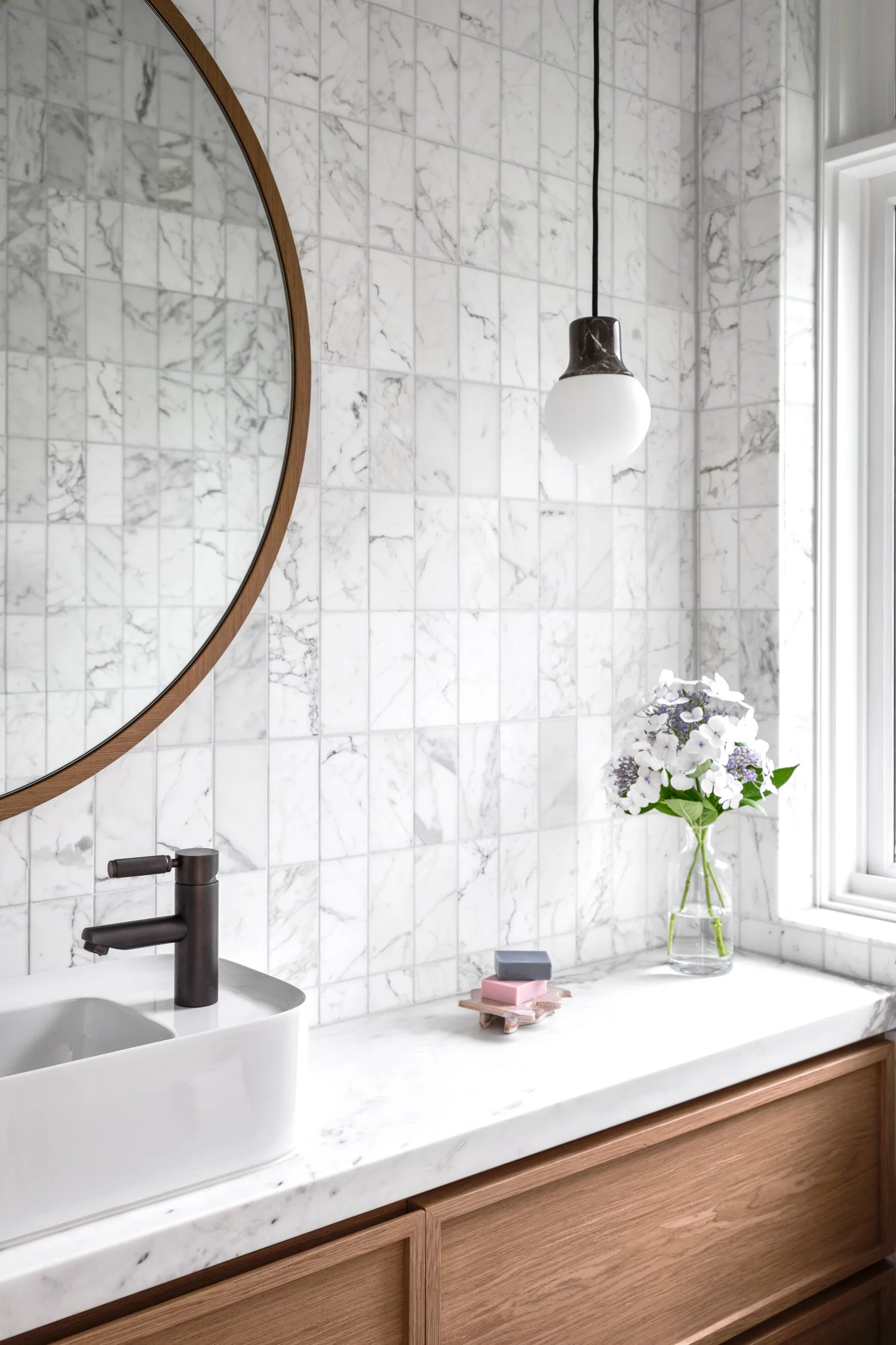 art deco home renovation bathroom calacatta subway tiles