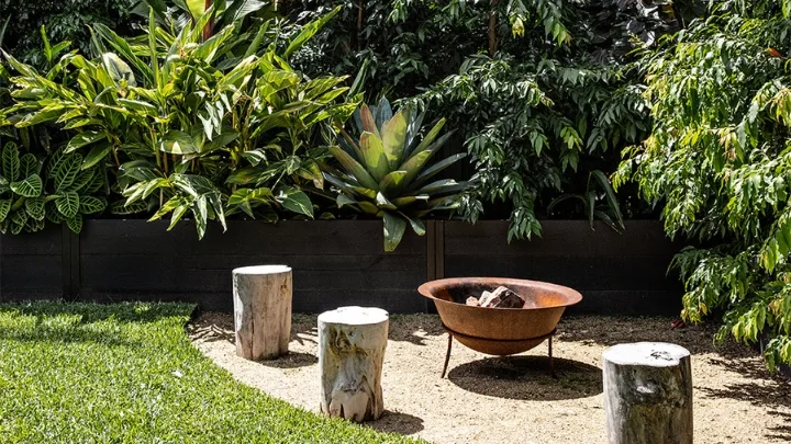 Outdoor fire pit with timber log stools