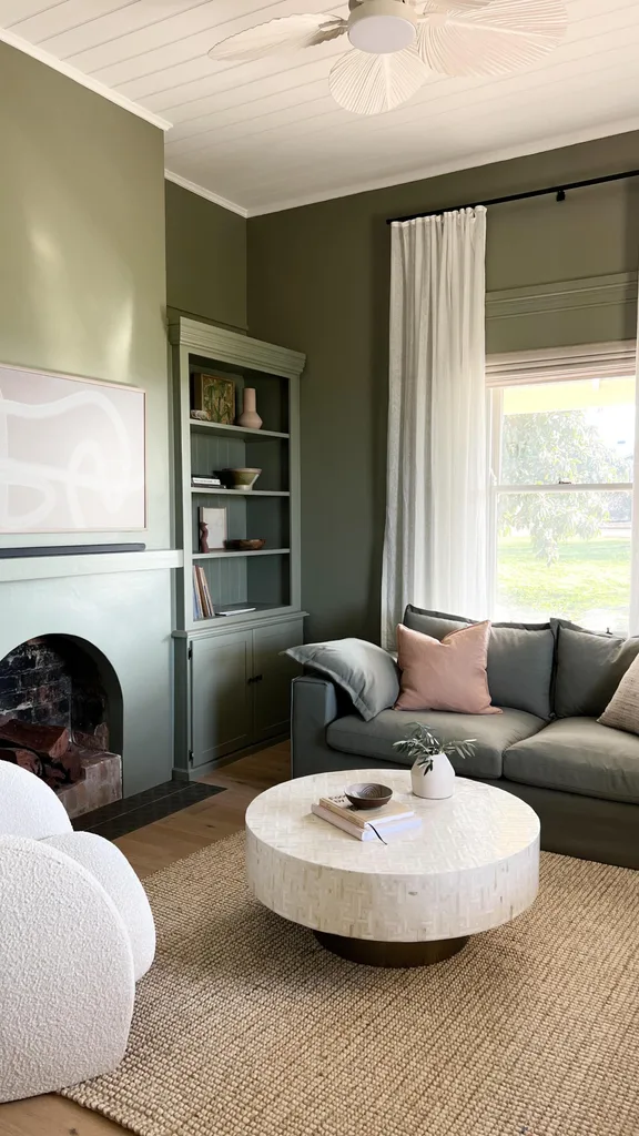 Living room and rumpus room painted in a warm green shade.