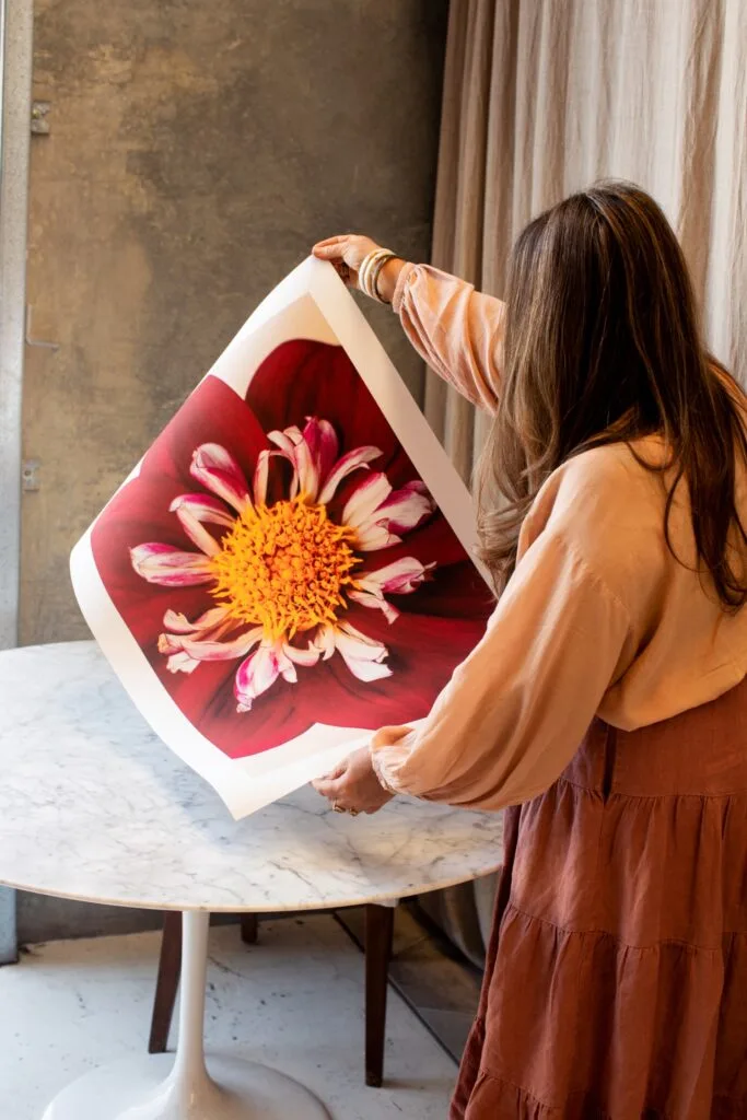 Photographer Kara Rosenlund Holding Print