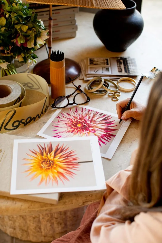 Photographer Kara Rosenlund Signing Her Work