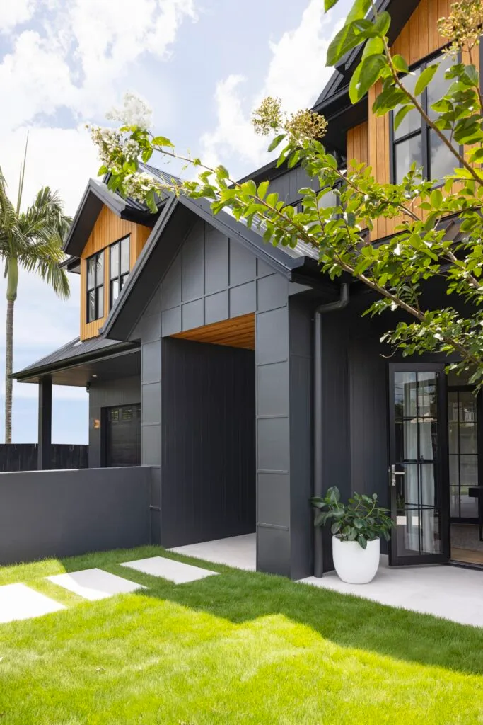 european farmhouse style build brisbane black house dulux domino