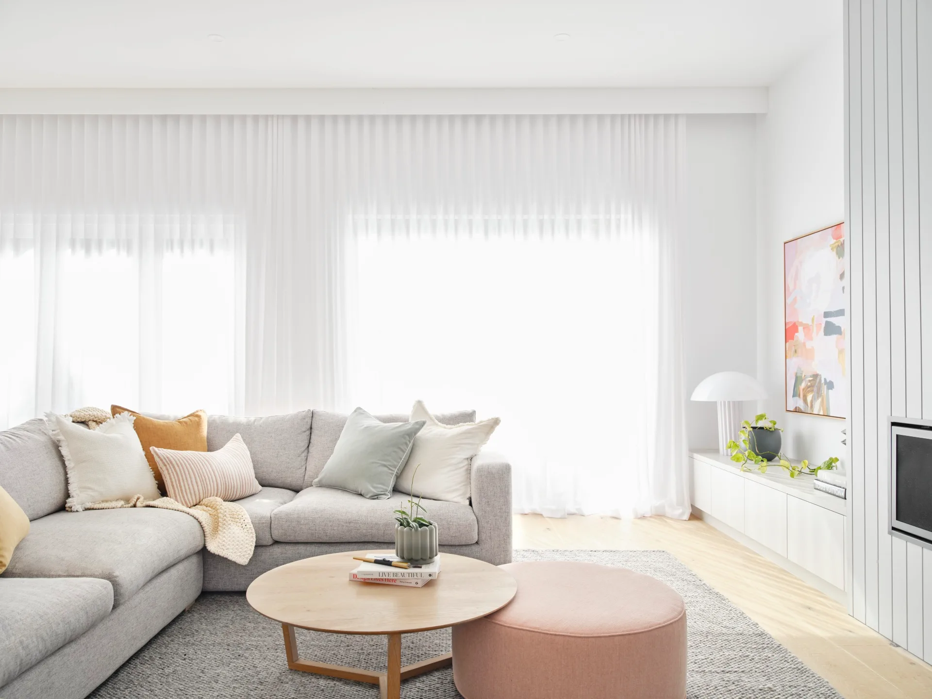Scandi style open plan living with large windows.