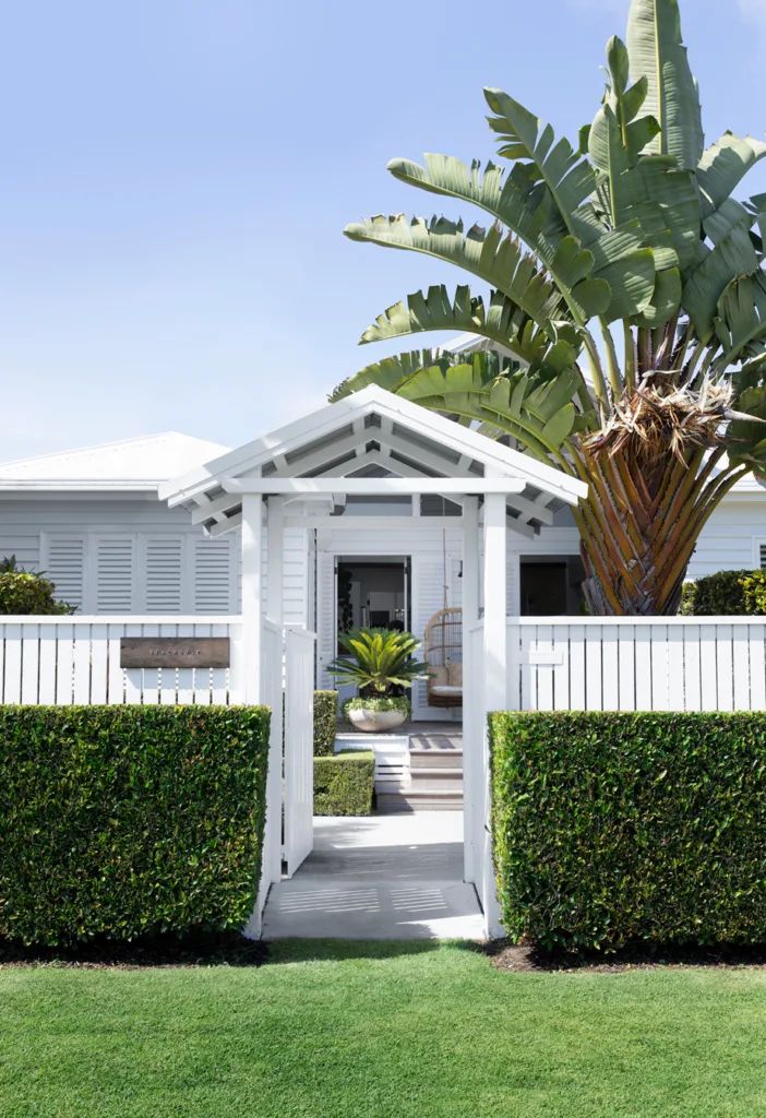 Hamptons coastal chic front facade and hedges.