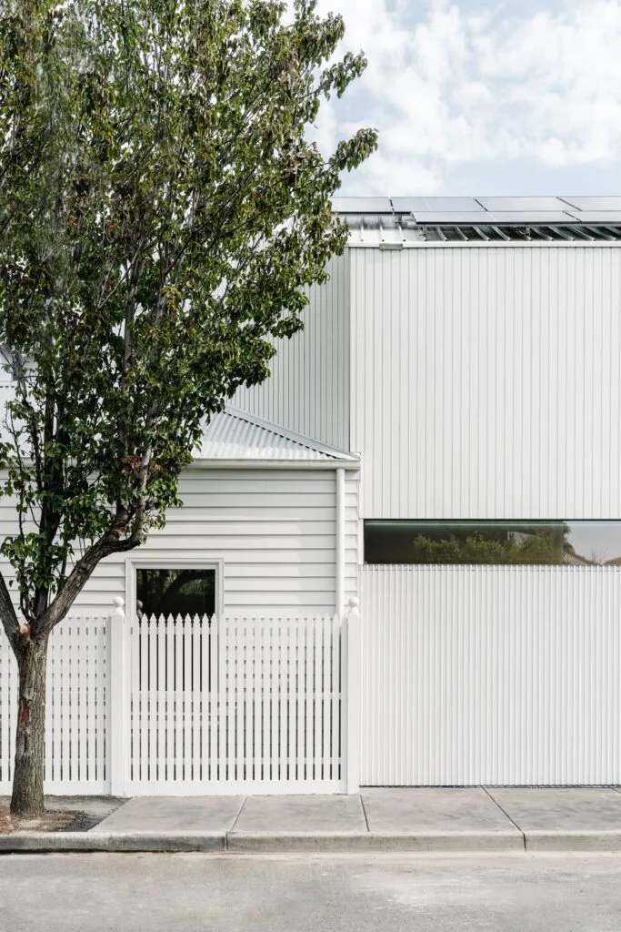 Melbourne energy efficient home with white picket fence.