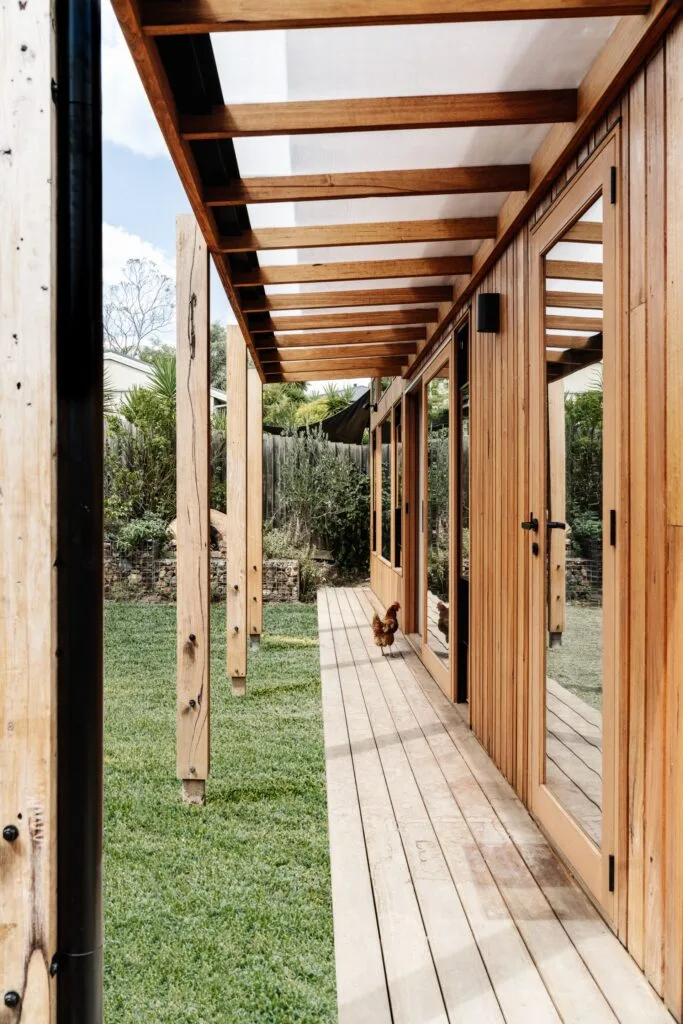 Outdoor deck with timber cladding and chicken.