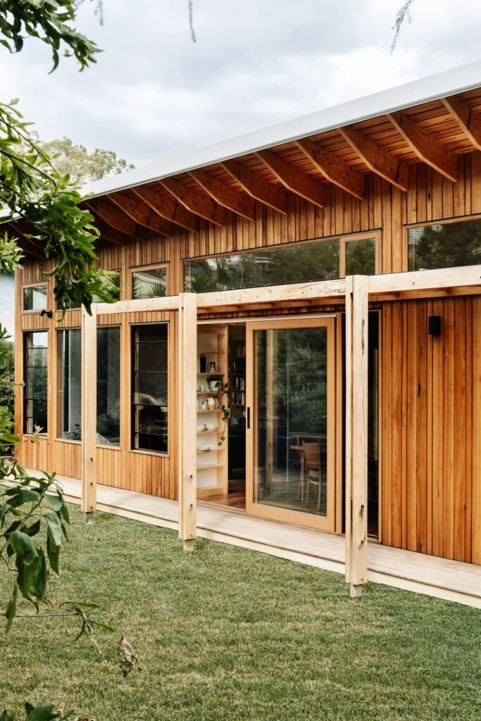 Outdoor deck with reclaimed timber cladding.