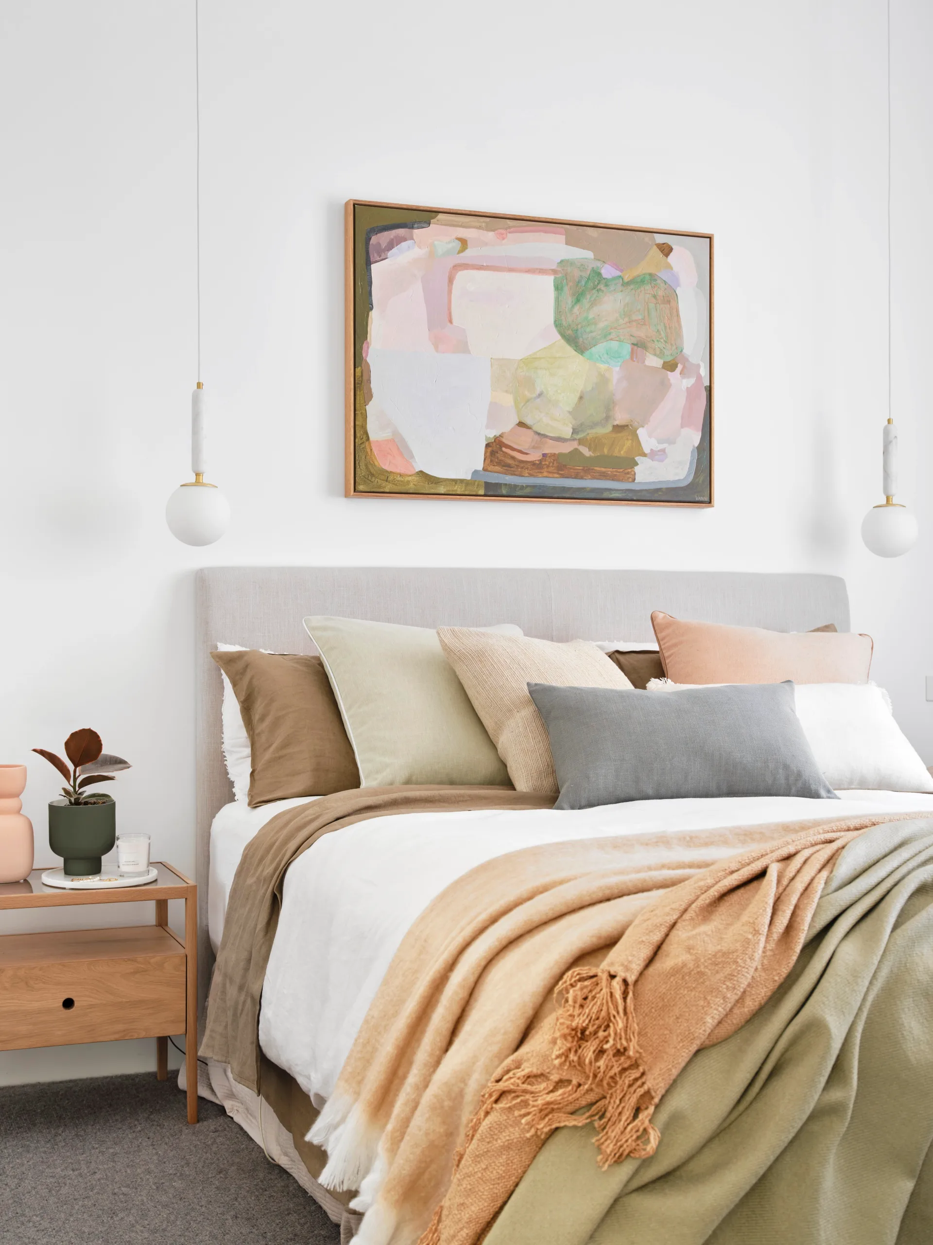 Modern Scandi style main bedroom with abstract canvas wall print.