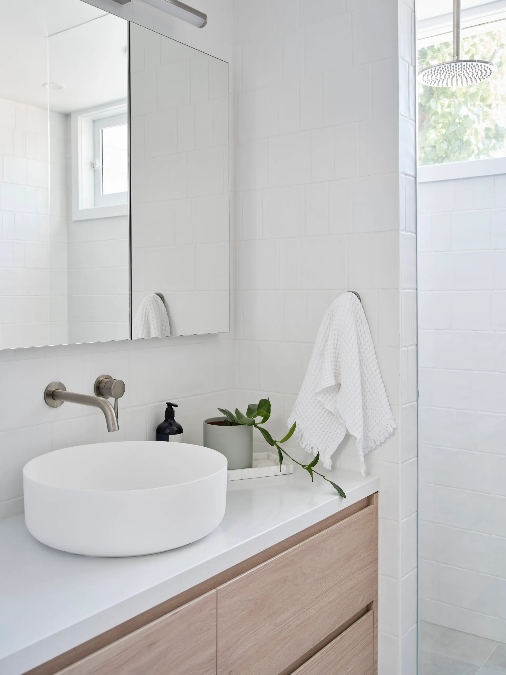 Modern Scandi style ensuite with subway tiles.