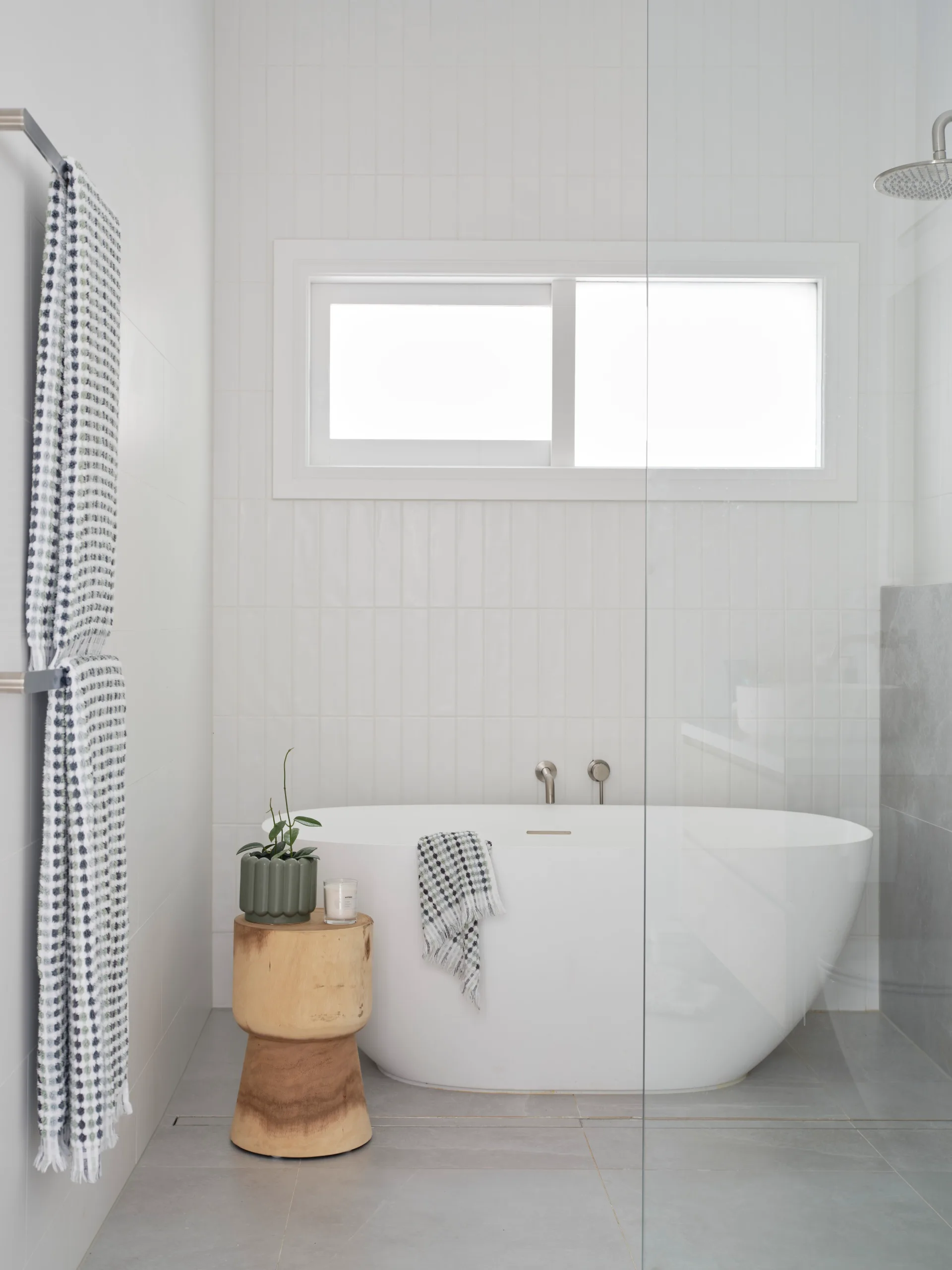 Renovated family bathroom and white subway tiles with bath.