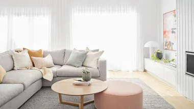 Minimalist scandi style living room with grey and pastel colour palette.