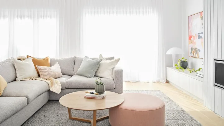 Minimalist scandi style living room with grey and pastel colour palette.