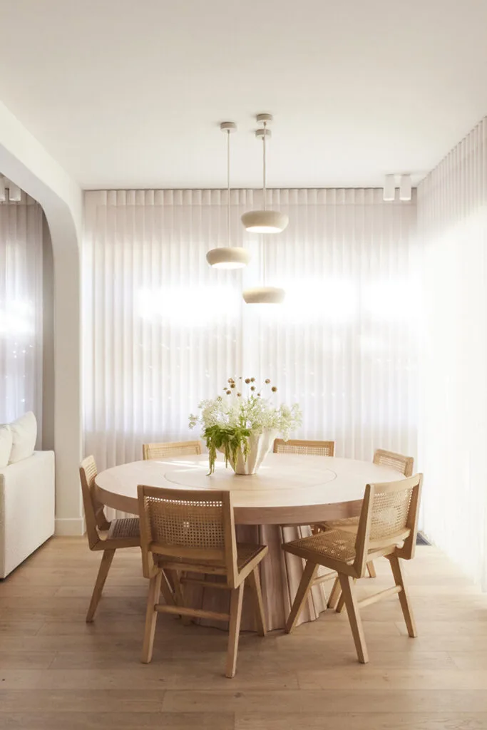 Dining room with round Christian Cole timber table from The Block 2023 House 1.