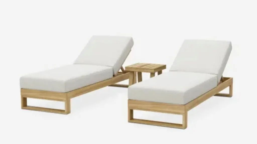 Beige and wooden outdoor sun loungers with a wooden side table