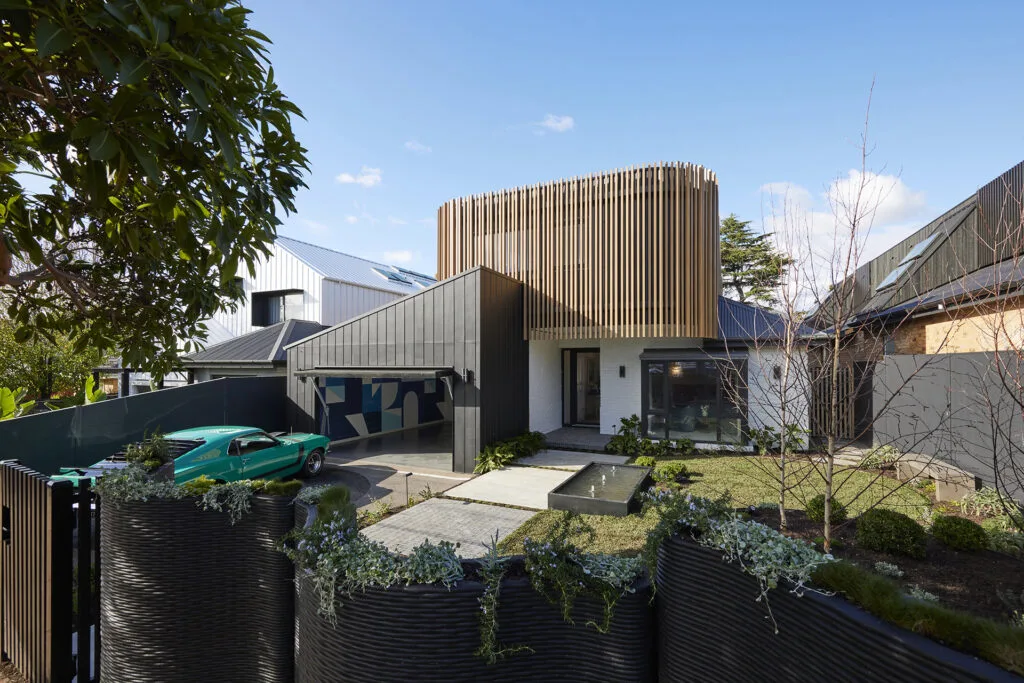 Leah and Ash's front garden with 3D printed wavy fence designed by architect Julian Brenchley.