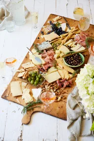 Antipasto grazing platter served on a timber board.