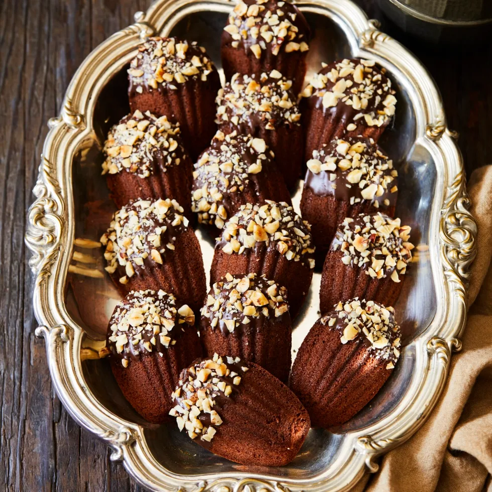 Chocolate hazelnut madeleines on a tray.