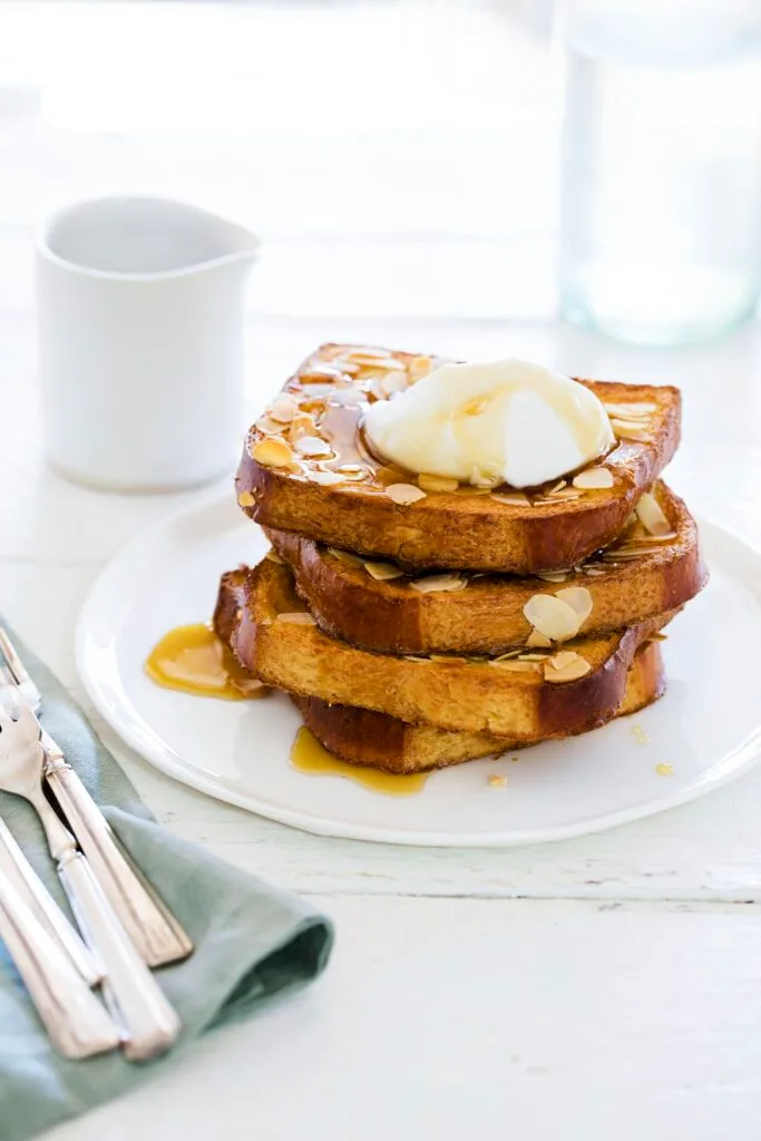 Coconut and almond brioche French toast stack.