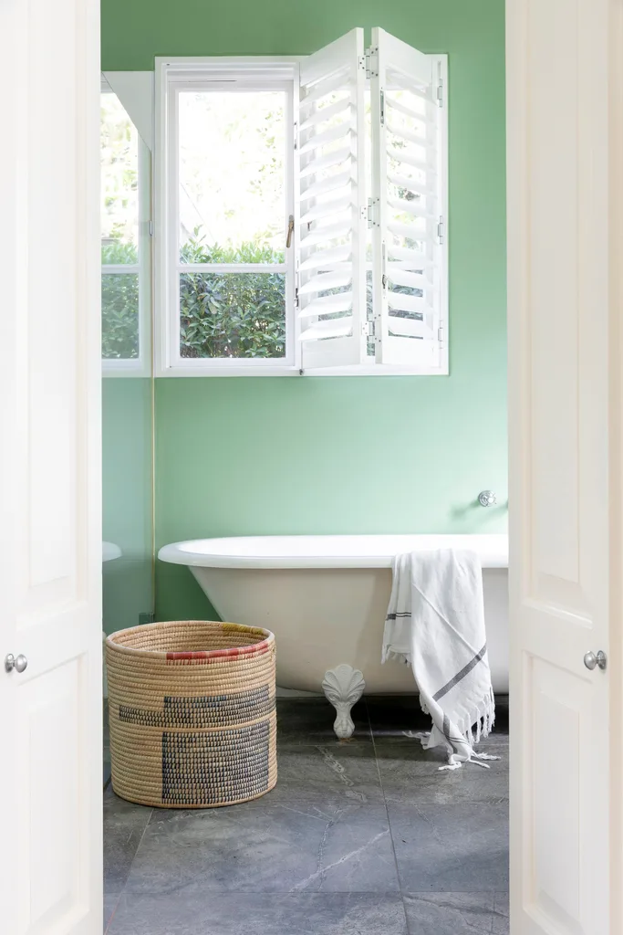 Eclectic green bathroom and clawfoot tub.