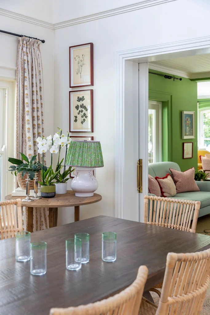 Dining room table and small framed wall art.