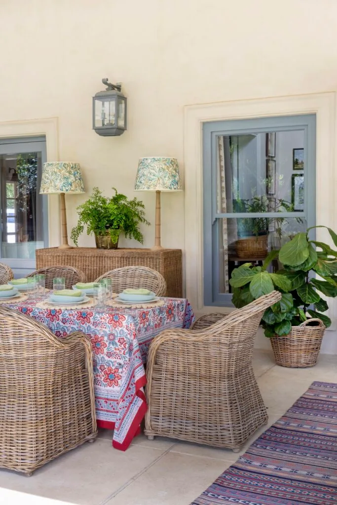 Veranda and dining table with rattan chairs.