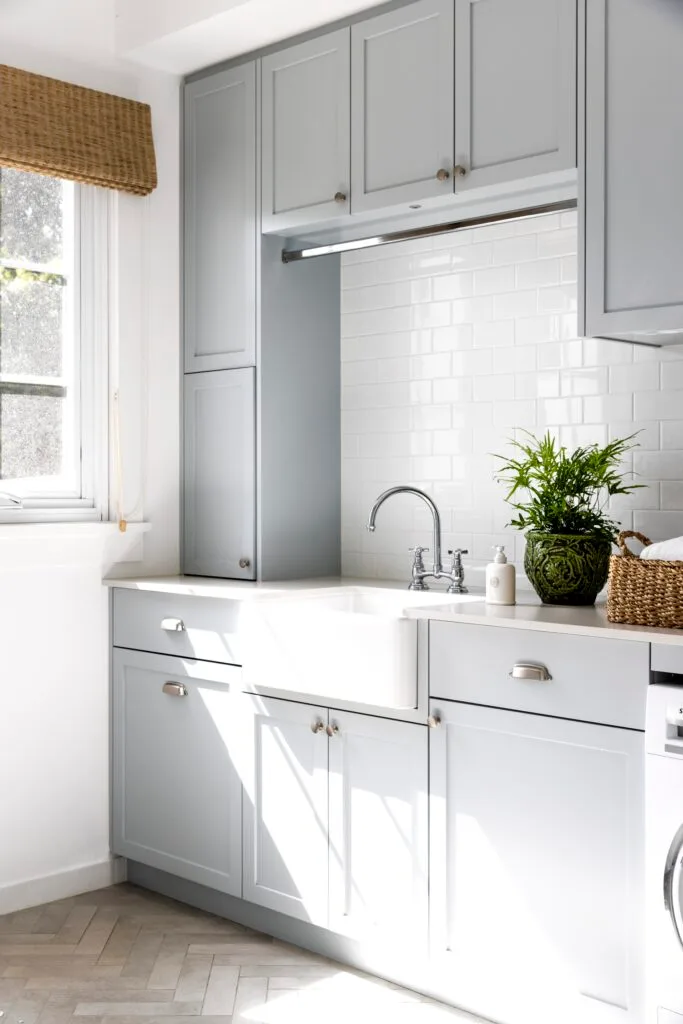 Grey and white laundry with butler's sink.