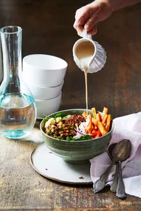 Sweet potato and chickpea bowl with dressing.