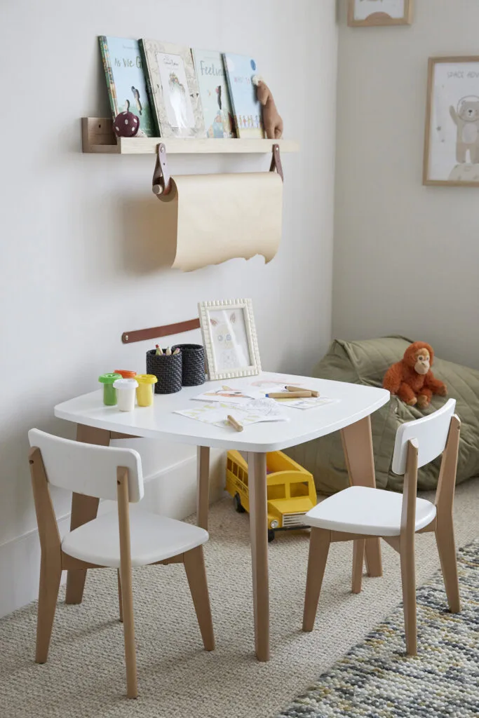 White and timber activity table in a kids' room with a neutral colour scheme