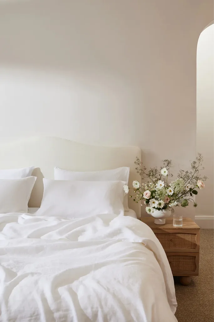 A bed with white linen from Bed Threads.