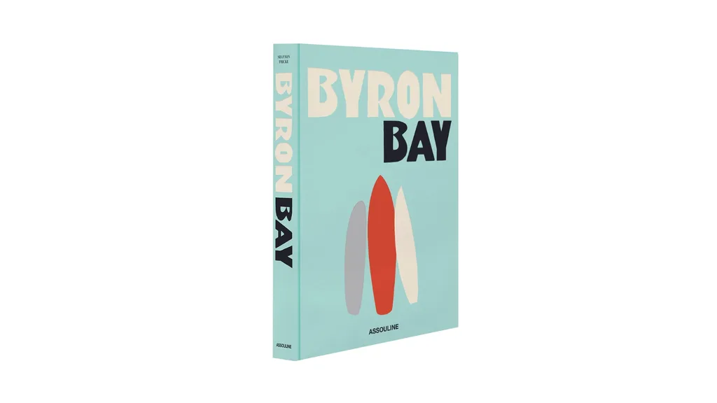 A hardcover blue book with three surfboards on the cover