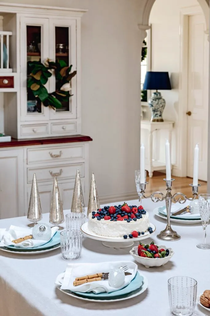 A Christmas table setting with festive baubles.