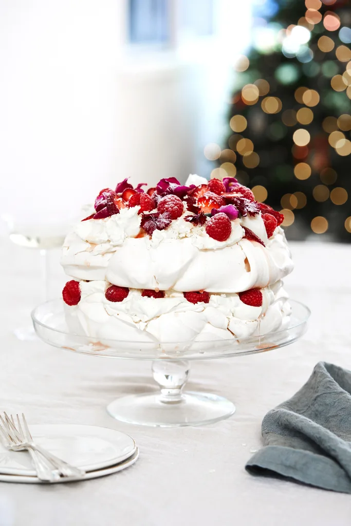White forest pavlova recipe with raspberries and strawberries.