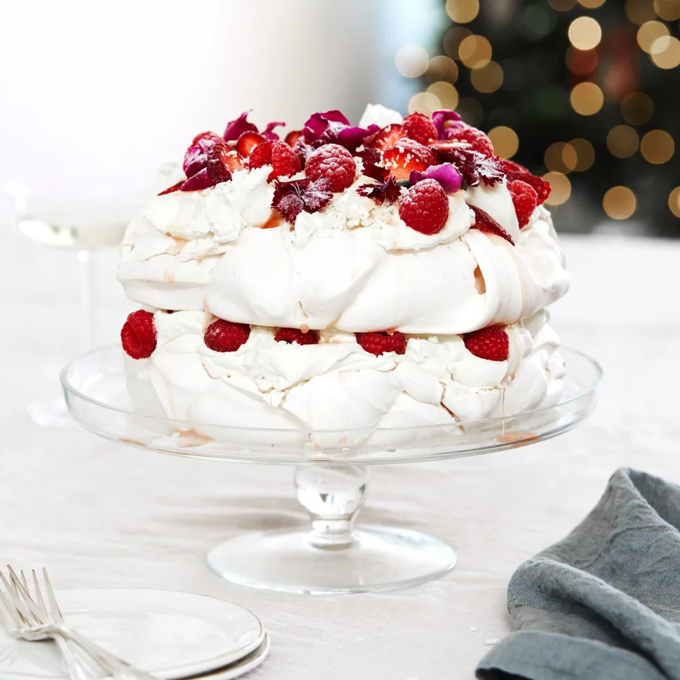 White forest pavlova with raspberries and strawberries.