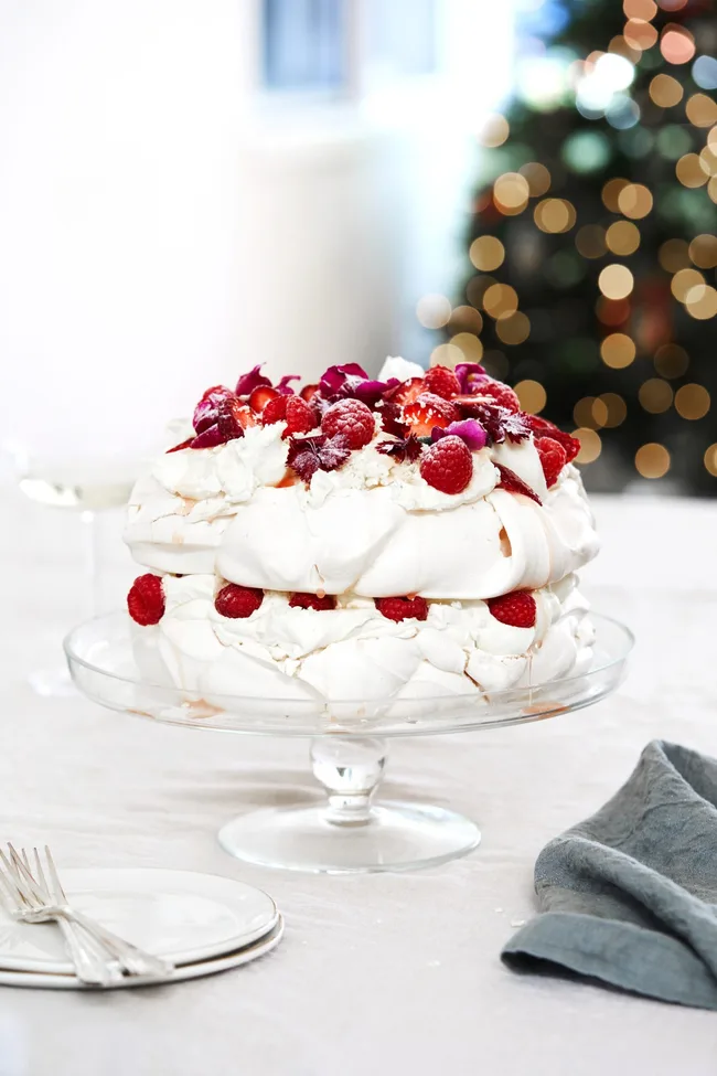 White forest pavlova with raspberries and strawberries.