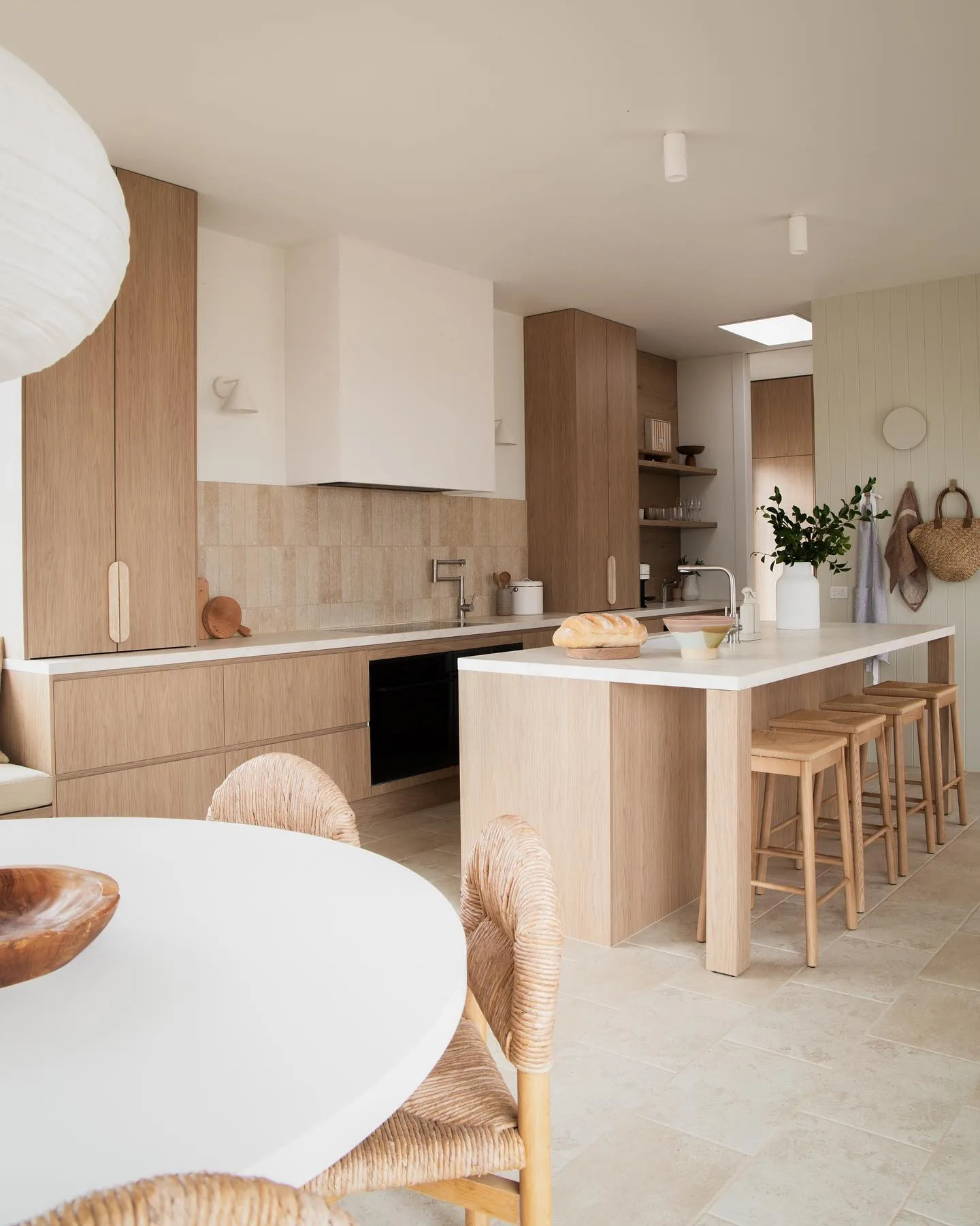 Contemporary, neutral open plan kitchen designed by Josh and Jenna Densten.