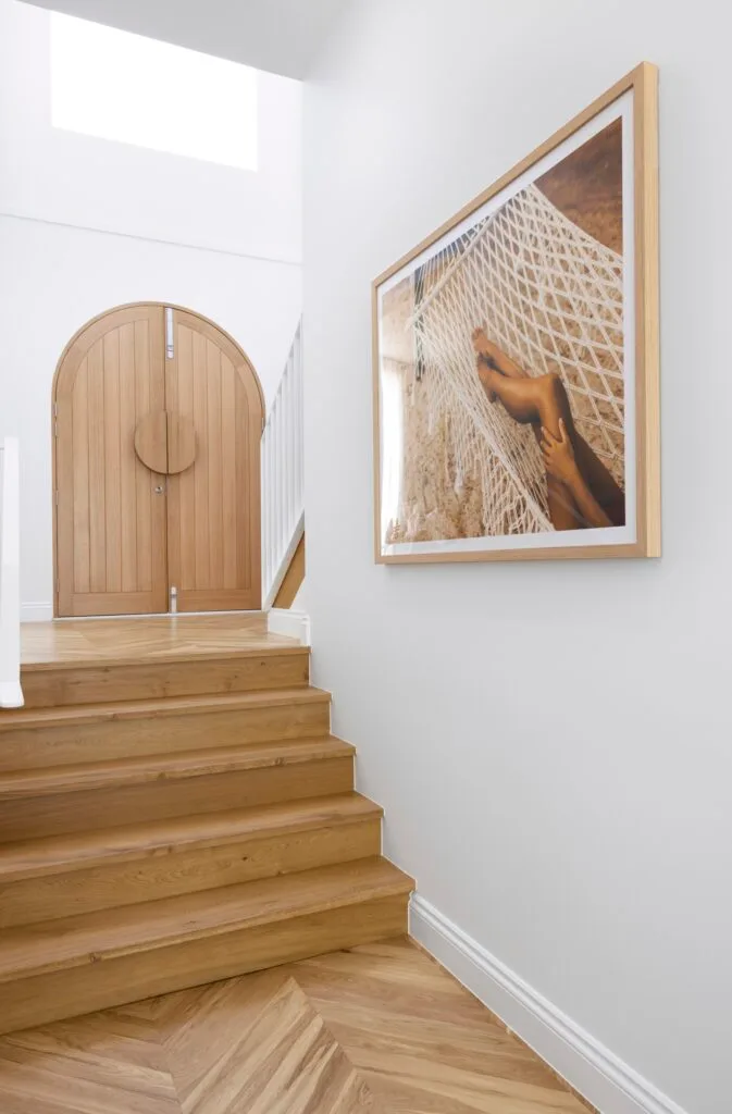 The entrance with double timber doors and timber steps.