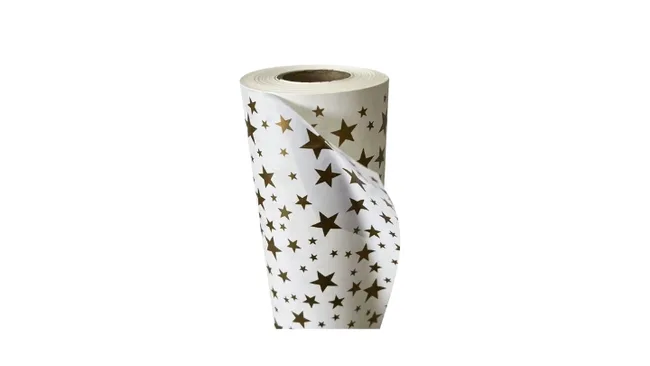 A roll of white paper with gold star patterns.