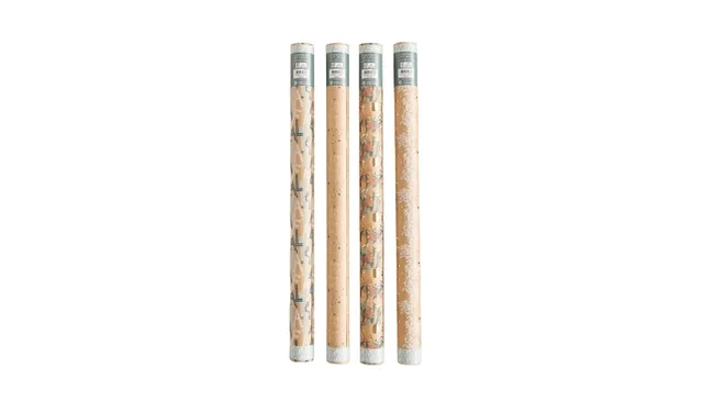 Four rolled sheets of patterned wrapping paper standing upright on a white background.