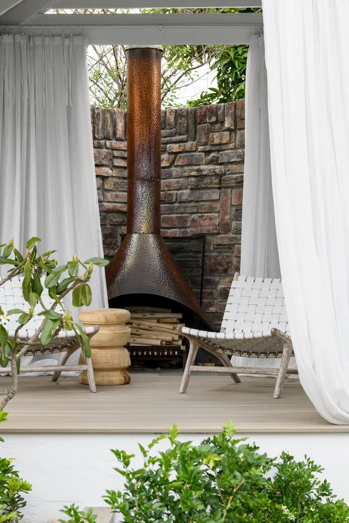 A vintage outdoor copper fireplace.
