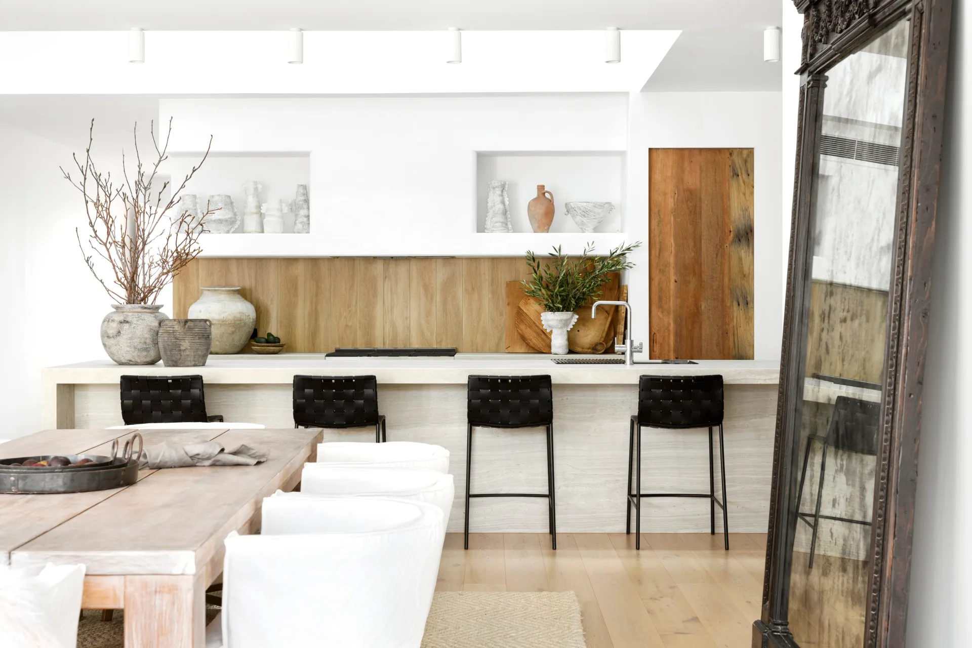 A white and timber kitchen with vintage and natural decor.