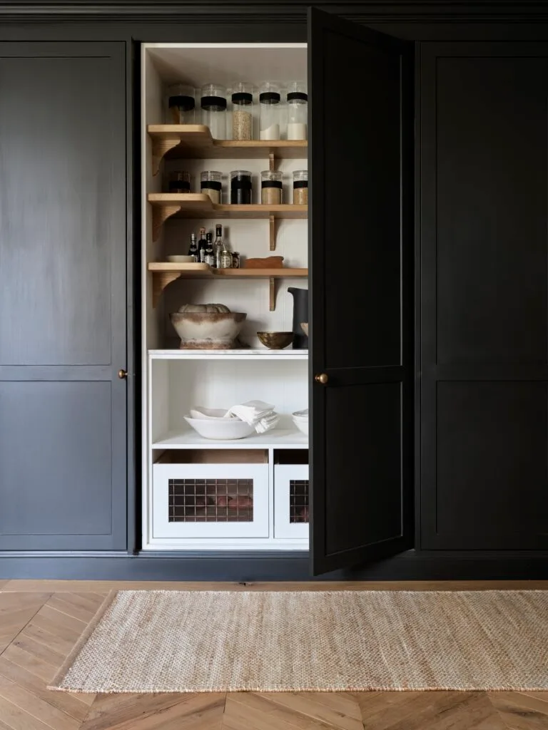 Black pantry cupboard and shelving.