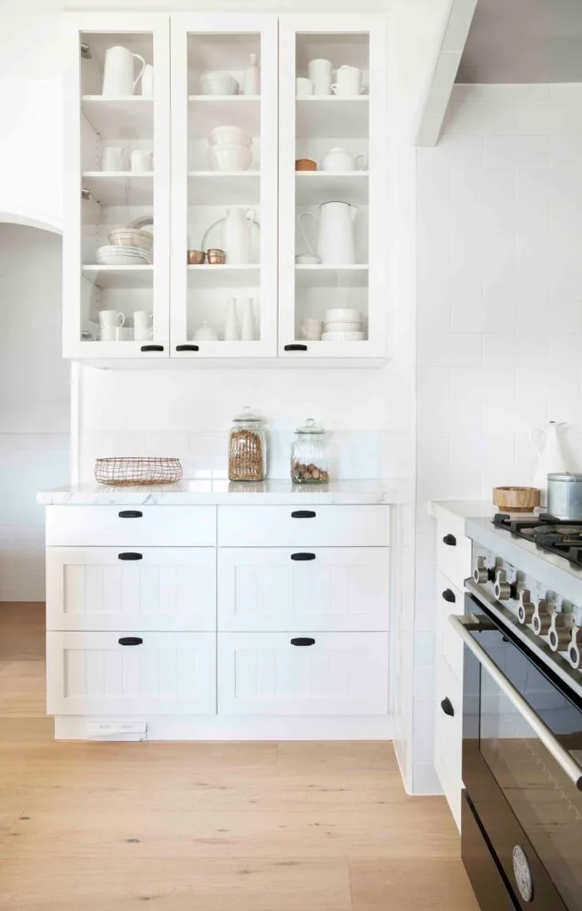 White contemporary kitchen storage cabinets.