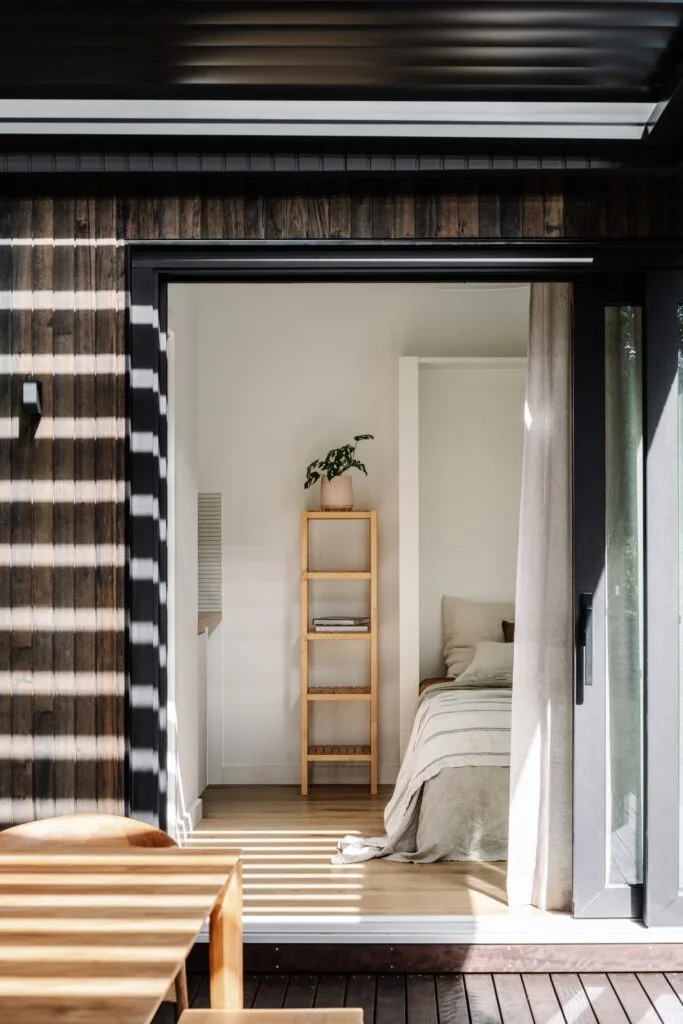 The studio and guest bedroom with timber cladding and oak flooring.