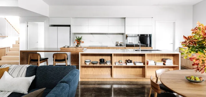 A Japandi style kitchen with open timber shelving and a raised white ceiling.