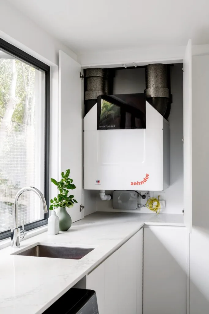 A Zehnder ComfoAir Q ventilation unit in the laundry.