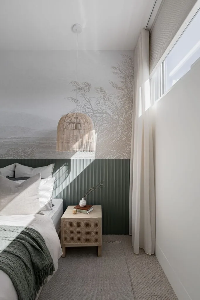 Japandi style bedroom with green fluted wall details and natural wallpaper.